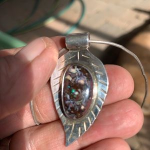 Silver and opal pendant on chain